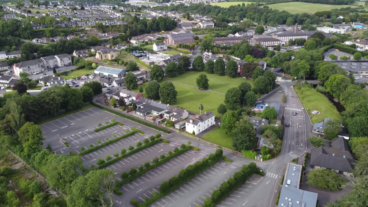 Blarney village and large castle car park Ireland drone aerial footage