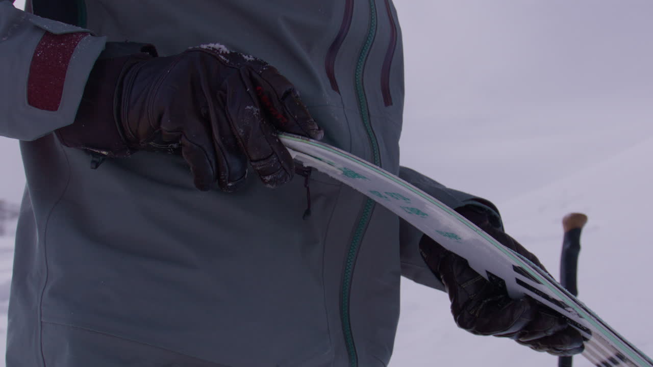 Two freeriders ski tour up the majestic Alphubel with their guide, then descend through glacial terrain surrounded by crevasses and seracs in the high alpine landscape of Saas-Fee