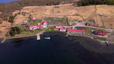 drone shot flying backwards while panning up of the estancia harberton in tierra del fuego, argentina