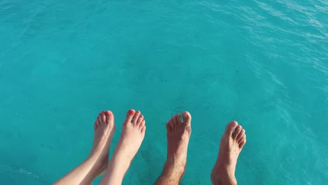 feet on deck of sailboat or yacht sailing in sea