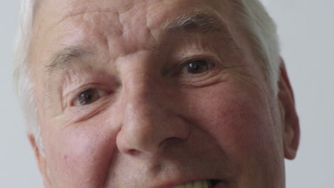 close-up-portrait-of-happy-elderly-man-smiling-enjoying-successful-retirement-lifestyle-satisfaction-looking-at-camera-on-white-background