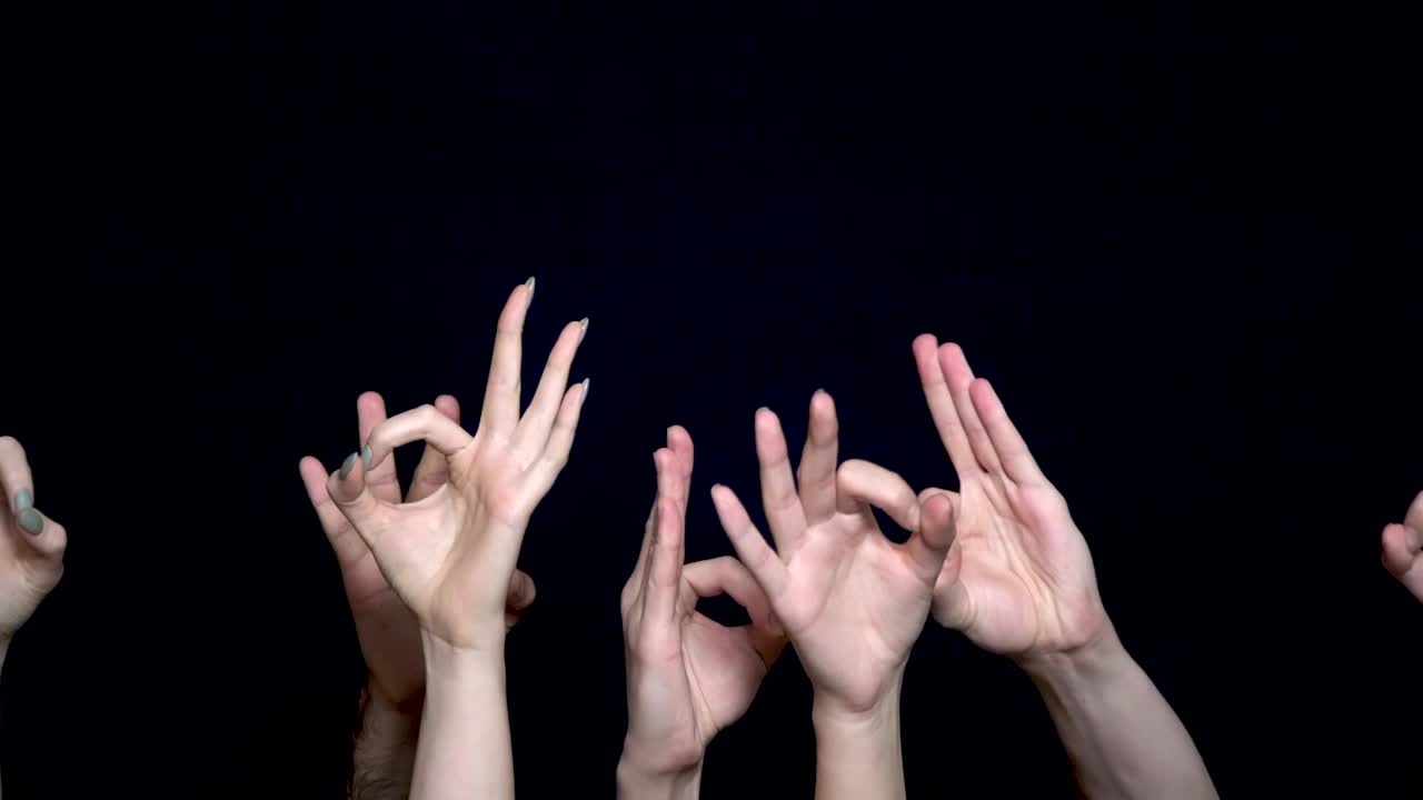 Multiple Hands Showing the OK Sign