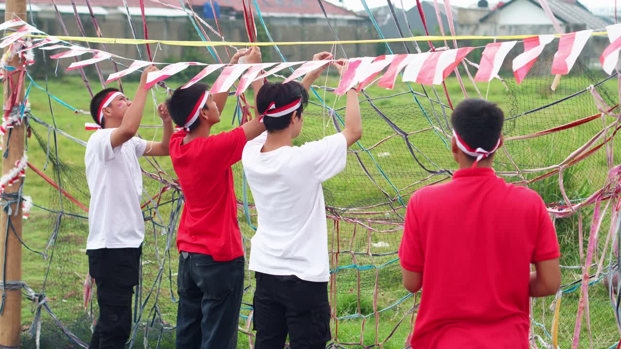 Friends With Red And White Headbands Full Of Joy And Preparing For Festive August 17th Celebration