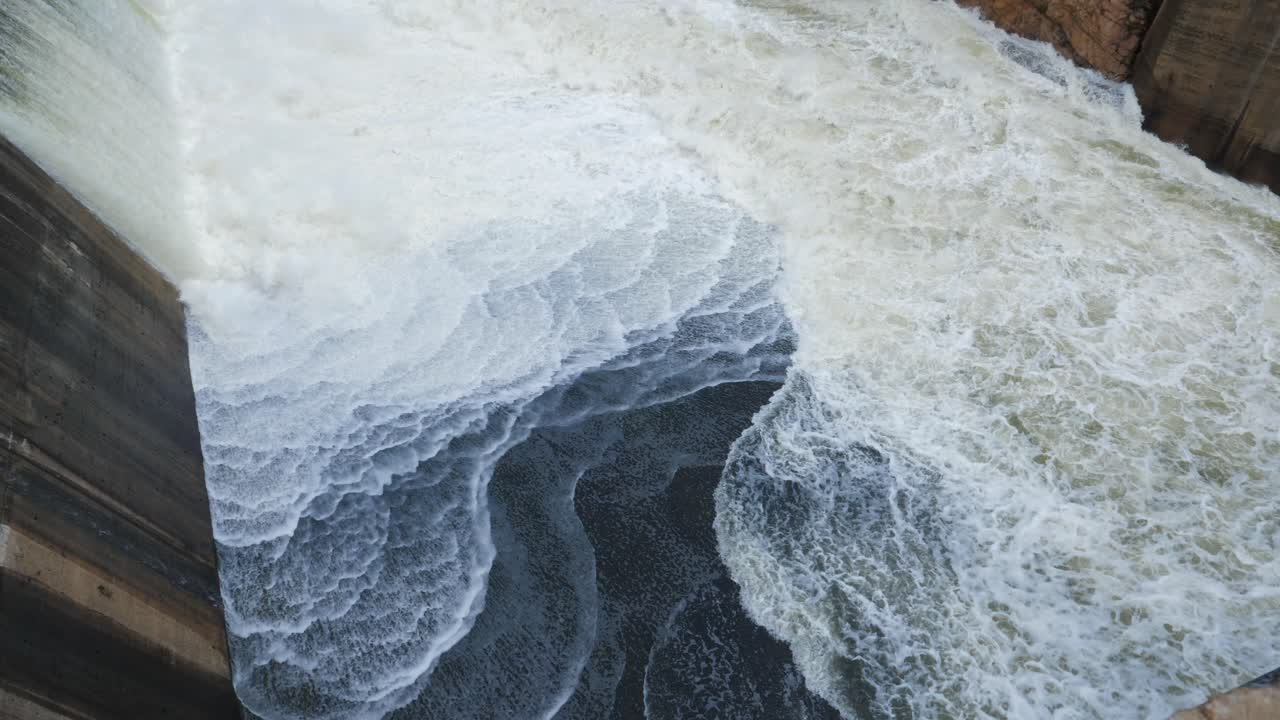 Roiling whitewater rushes down spillway at Hartbeespoort hydro dam