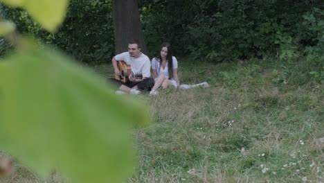 couple enjoying music in the park