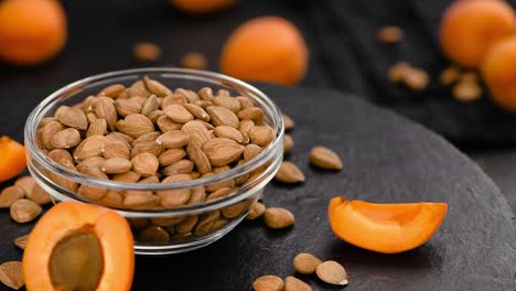 portion of shelled apricot kernels on a rotating plate (seamless loopable)