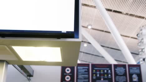 businesswoman showing her boarding pass at the check-in counter