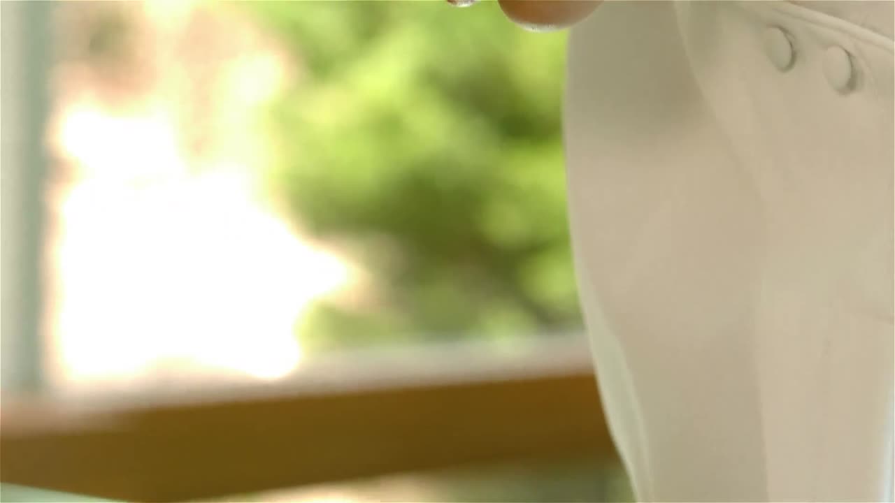 Beauty therapist tweezing eyebrows of a patient