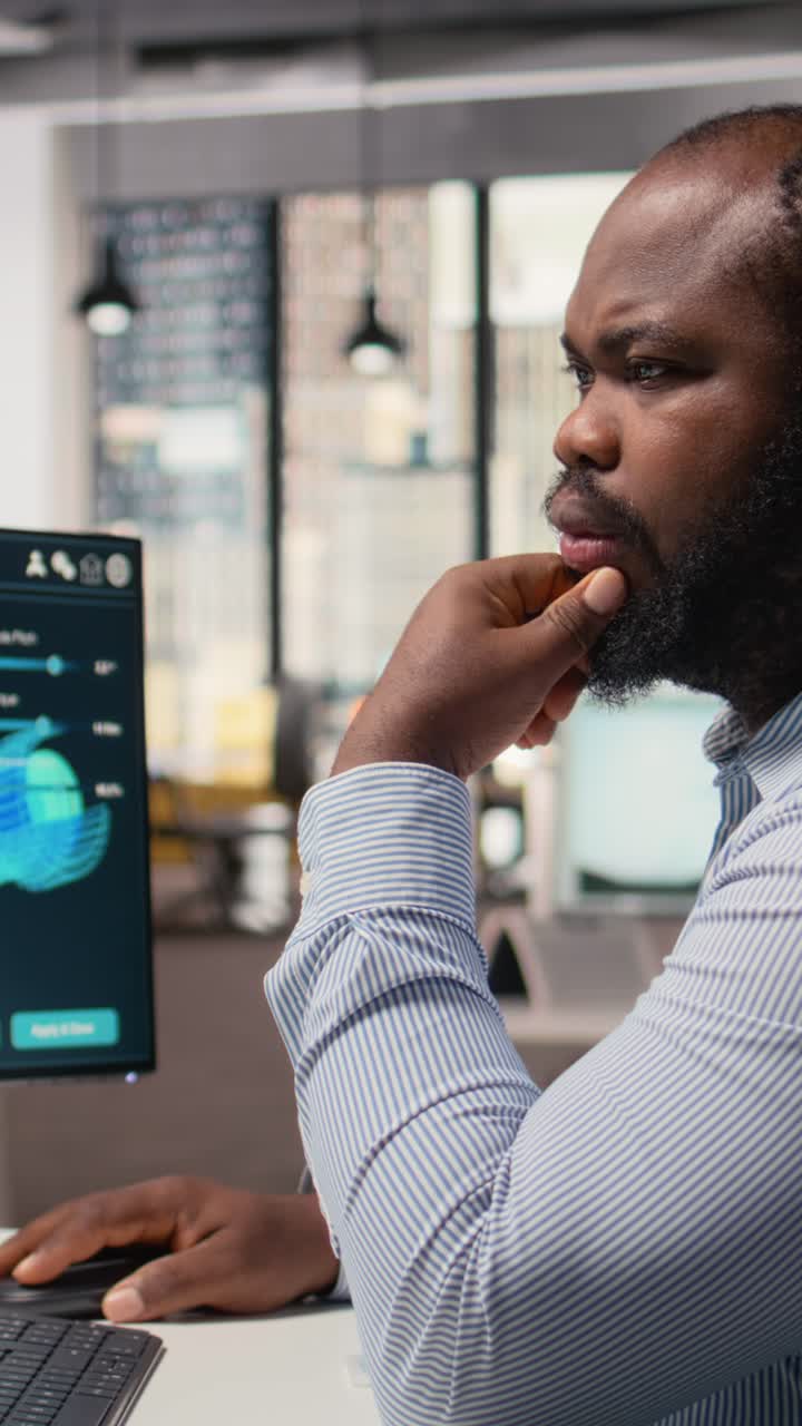 Technician uses software to plan wind farm layout, determining turbine placement