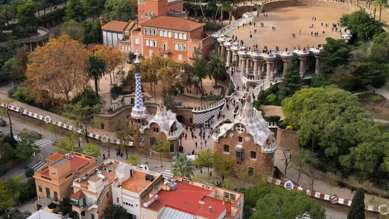 Aerial drone view of Barcelona, Spain. Park Guell with tourists, a lot of greenery