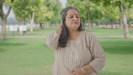 Confused-Indian-old-woman-thinking-in-park