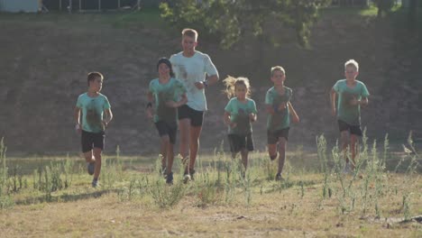 group of caucasian children training at boot camp