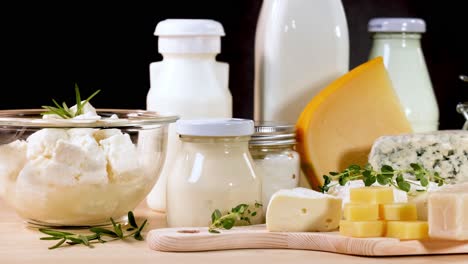 assorted dairy items arranged on a wooden surface