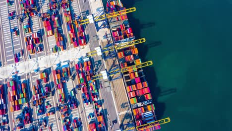 container ship loading and unloading in deep sea port, aerial view circle container shipyard business logistic import and export cargo freight ship, transportation by container ship in open sea, timelapse 4k.