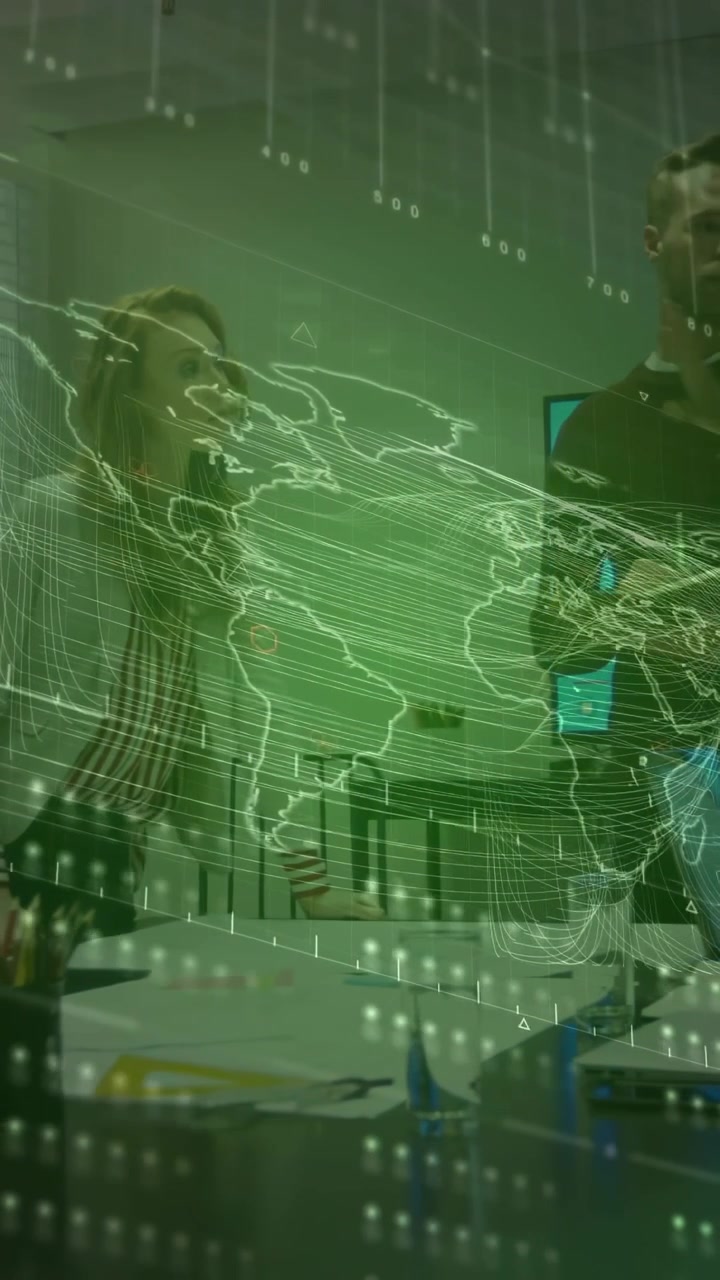 Vertical video: Tech team at table, man holding phone starting green map overlay, discussing data