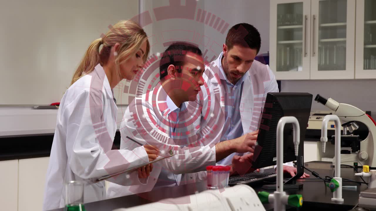 Lab team leaning at bench PC right colleague pointing causing central typing, red overlay hovering
