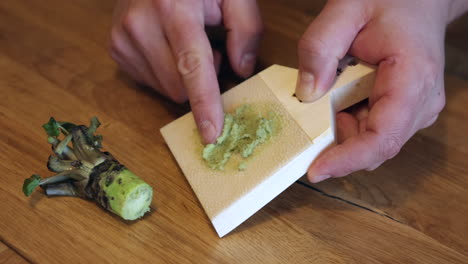 Sushi-chef-preparing-fresh-wasabi-for-omakase-dinner-in-restaurant