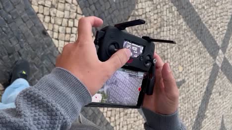 close-up of drone remote control in mans hands