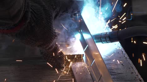 welder works in metal construction - construction and processing of steel components