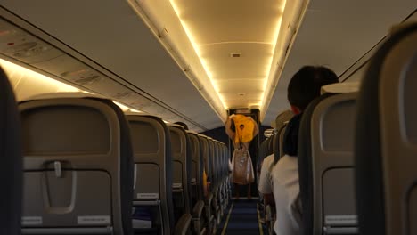 flight attendant giving safety instructions to plane passenger slow-mo 4k