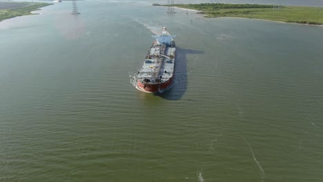 Aerial-establishing-shot-of-large-tanker-boat-in-water