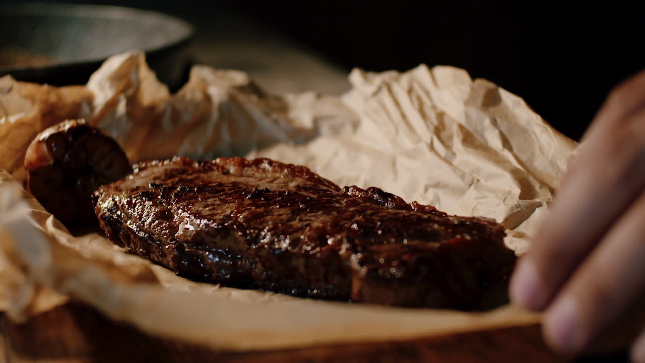 Close up of a perfectly cooked steak being plated