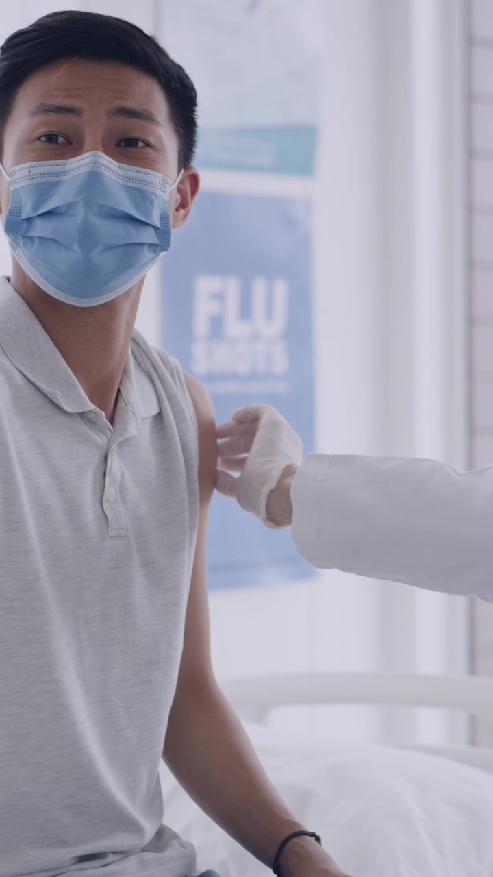 Young Man Receiving a Vaccination in a Medical Clinic