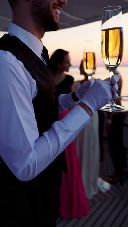 champagne toast on a yacht at sunset