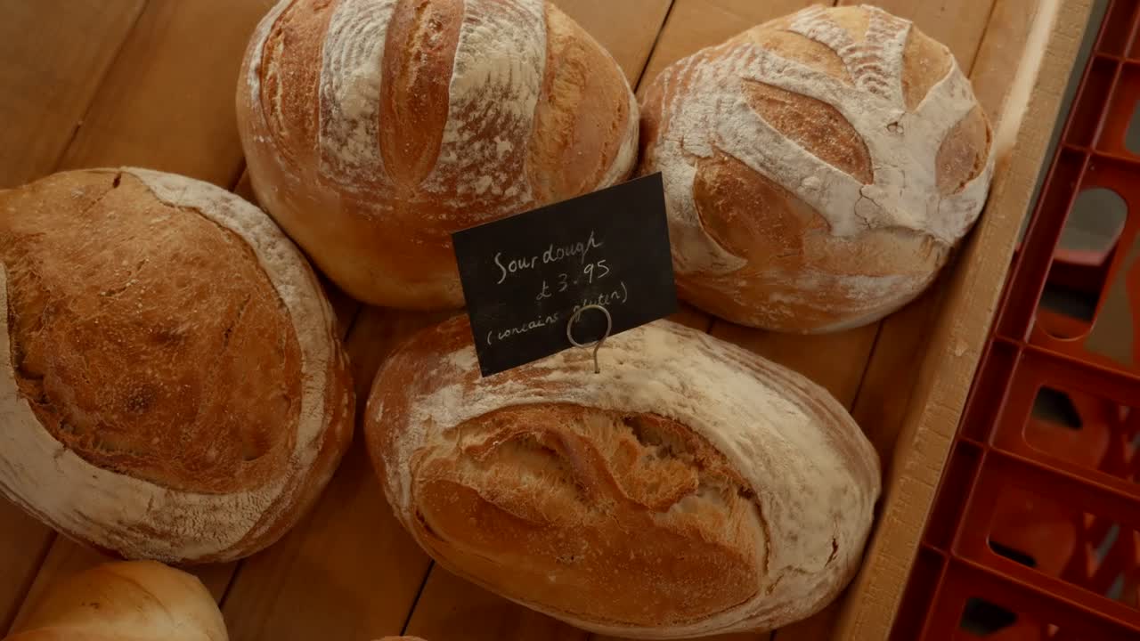 Top down medium, orbit shot of Sour dough loaves in farm shop during daytime