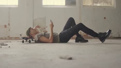 Fashionable young man in an abandoned warehouse
