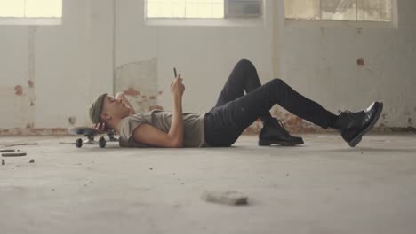 fashionable young man in an abandoned warehouse