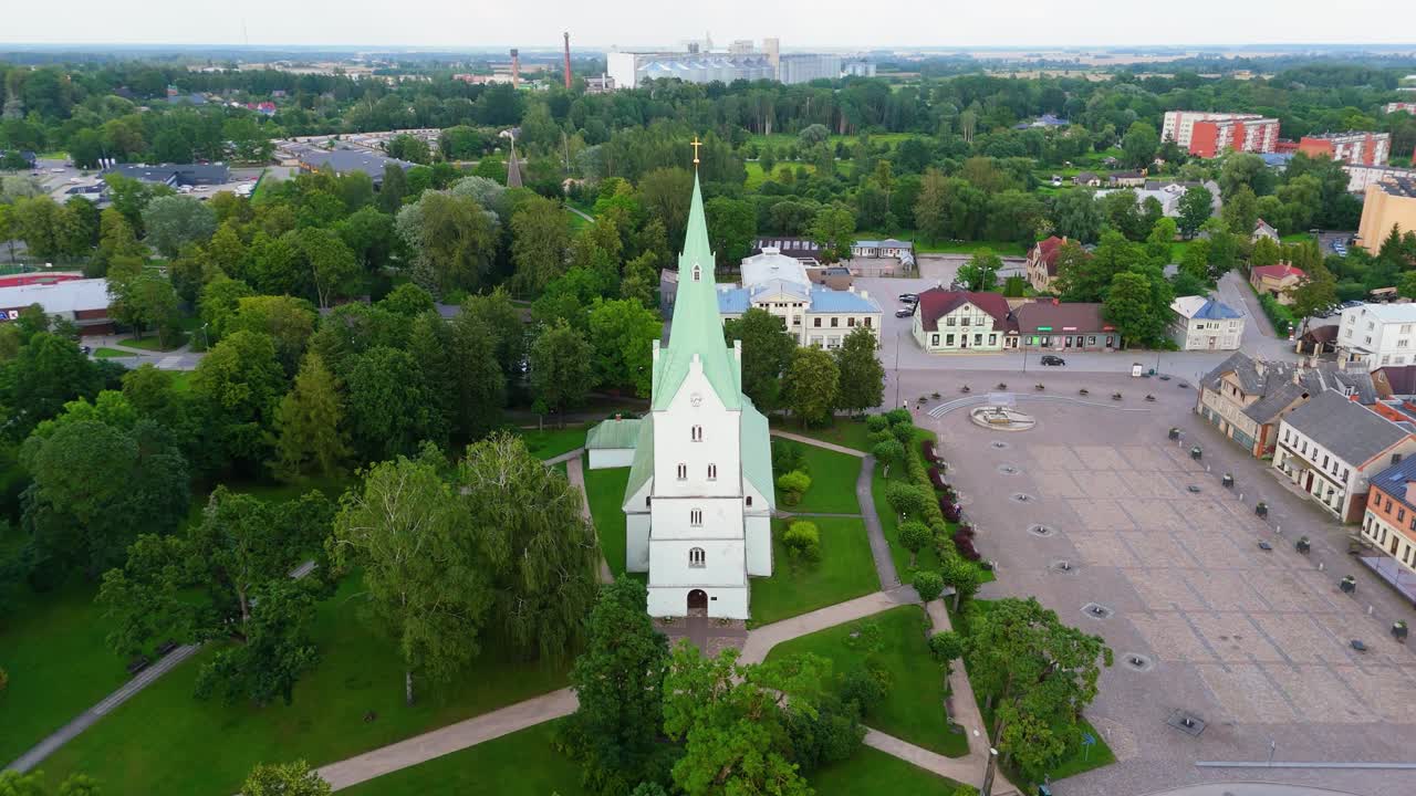 Aerial Panorama of Dobele Town Center and Evangelical Lutheran Church at Summer Scenic Drone View in Golden Hour Light Over Dobeles Historic Center on a Warm Summer Evening Peaceful Latvian Town