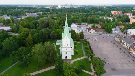 aerial panorama of dobele town center and evangelical lutheran church at summer scenic drone view in golden hour light over dobeles historic center on a warm summer evening peaceful latvian town