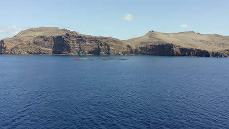 colorful fishing nets at the atlantic ocean and the rocky landscape of madeira island in portugal