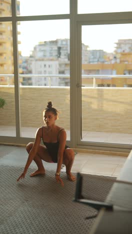 woman exercising indoors near a ping pong table