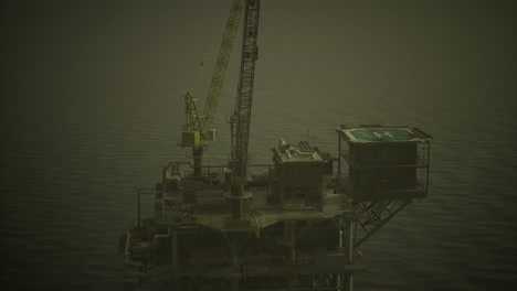 offshore drilling platform surrounded by calm waters at dusk