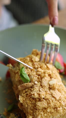 person eating a piece of cake