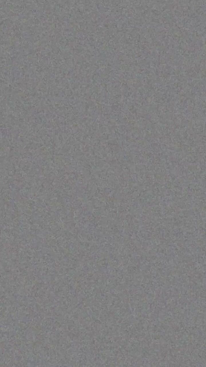 Vertical format uniform grey film grain and noise texture overlay for cinematic retro look