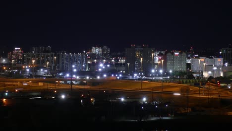 TIME-LAPSE---Avenue-and-buildings-at-night,-Toronto,-Ontario,-Canada,-wide-shot