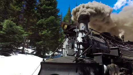 low angle rise up of cumbres and toltec steam train moving through colorado mounatins near chama new mexico 1