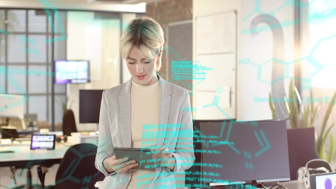 Woman tapping tablet and causing teal holo code spreading across technology office, reviewing data