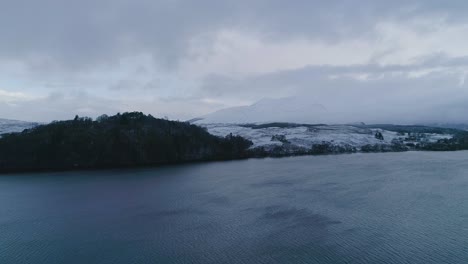 Aerial-shot-of-a-snowy-capped-Ben-Cruachan,-a-mountain-in-Argyll-and-Bute,-Scotland