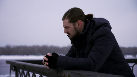 Man-standing-outdoors