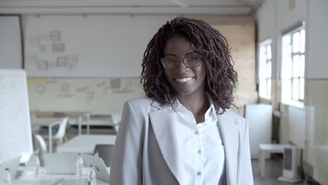 Content-African-American-businesswoman-smiling-at-camera