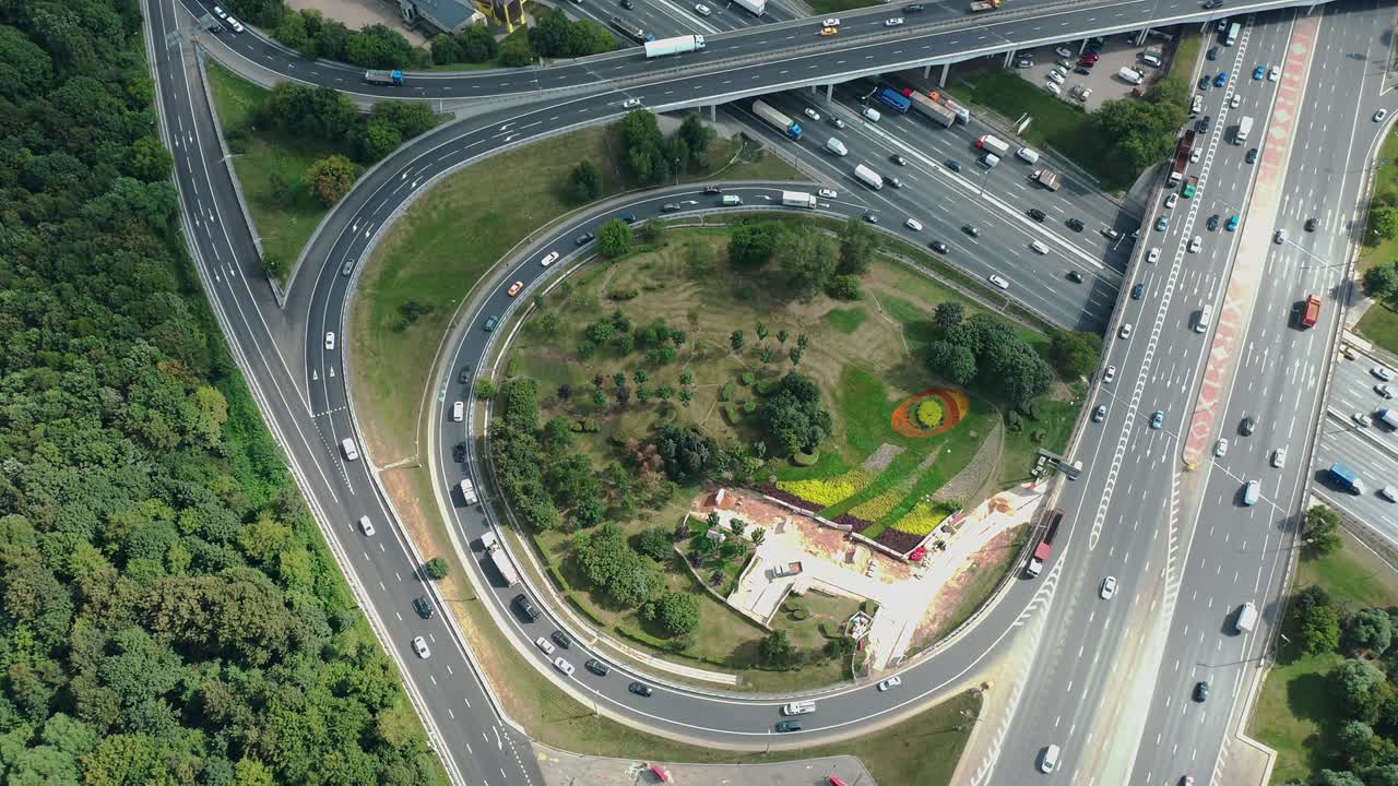 Top down aerial view of highway intersection with traffic