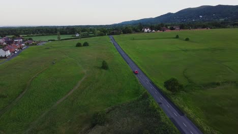 cars traveling through the west midland countryside