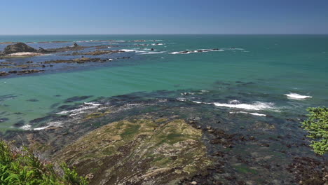 overlooking coos bay with mossy rocks near oregon coast at cape arago state park during summer