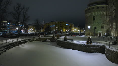 örebro castle and elite stora hotellet at night in the winter