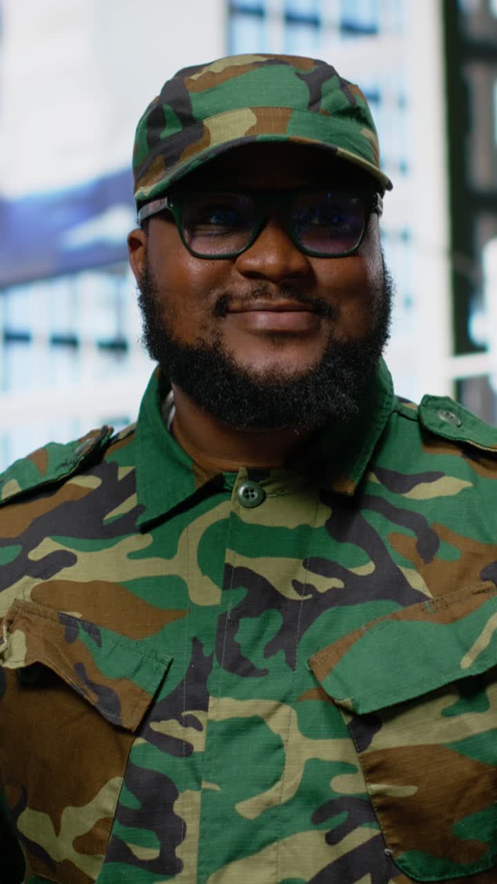 Vertical Video Adult male military service person walks through downtown center,