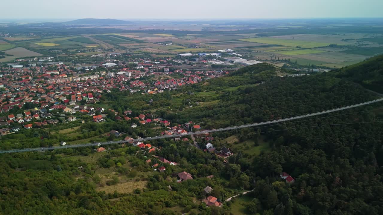 Panoramic drone view from the world's longest span pedestrian suspension bridge called the Bridge of National Unity in Sátoraljaújhely, Hungary